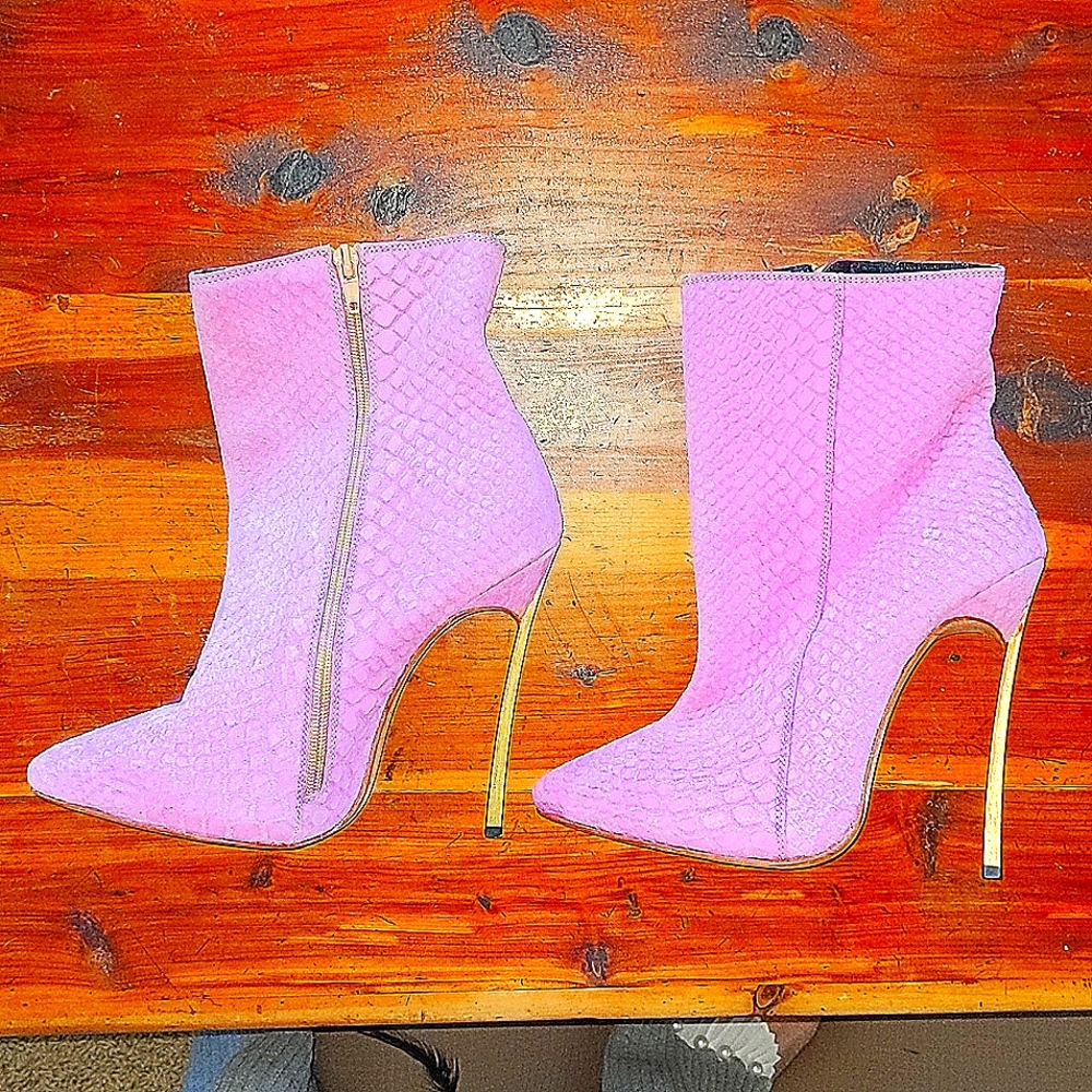 Pink suede stilletto boots.